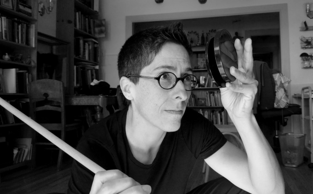 Alison Bechdel holding mirror